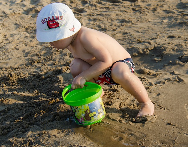 Baby playing in sand