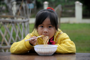 Child eating noodles